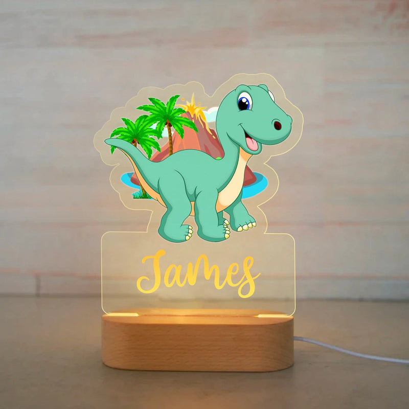 Veilleuse dinosaure personnalisée île aux palmiers avec prénom gravé, plaque acrylique allumée sur socle en bois