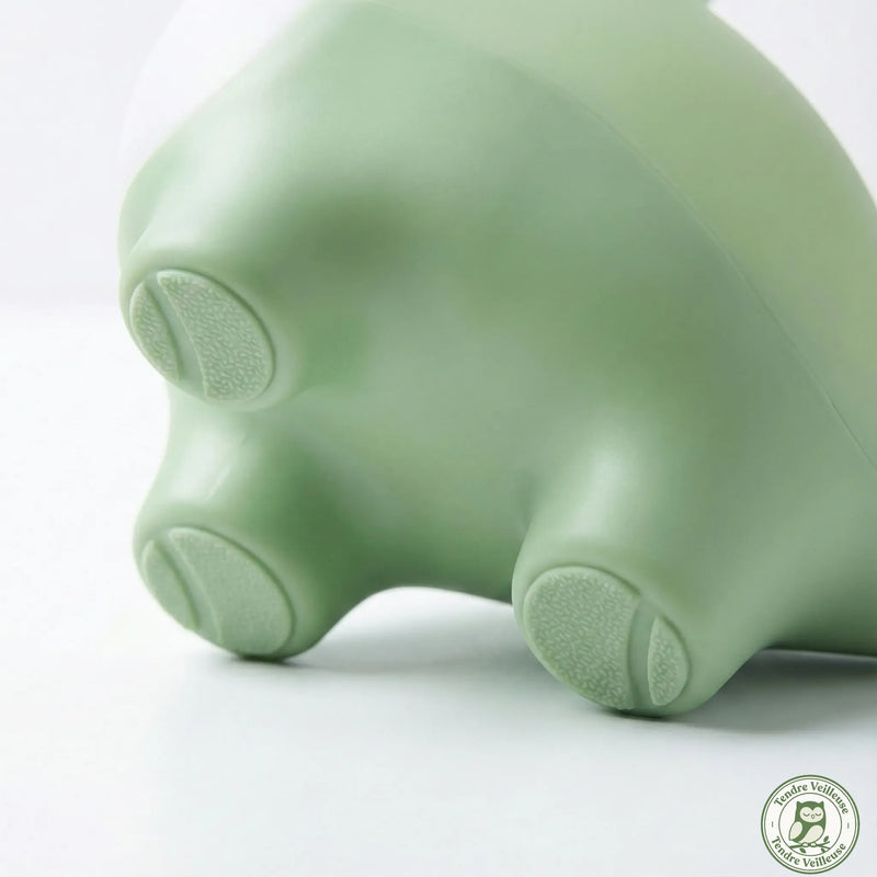 Détail des pieds en silicone souple antidérapant de la veilleuse dinosaure Rexy – sans BPA, sans angle vif