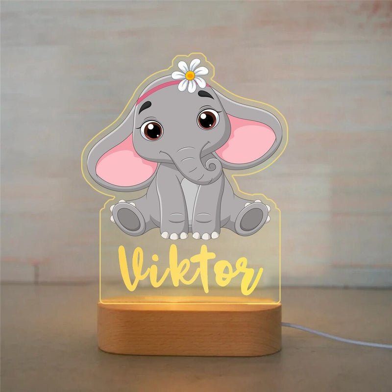 Veilleuse éléphant personnalisée petite fleur avec prénom gravé, plaque acrylique allumée sur socle en bois