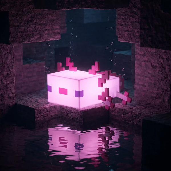 Veilleuse enfant Axolotl allumée diffusant une lumière rose apaisante dans l'obscurité, agissant comme un compagnon lumineux contre la peur du noir.