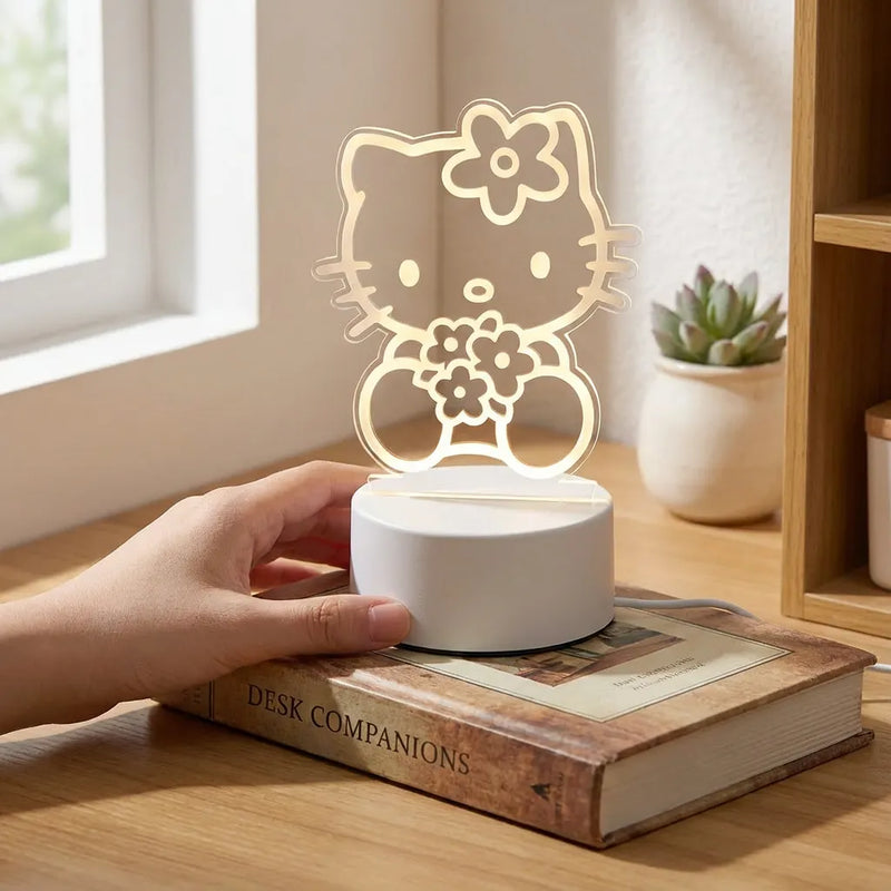 Veilleuse Hello Kitty LED acrylique allumee tenue en main echelle bureau bois lumiere chaude Tendre Veilleuse