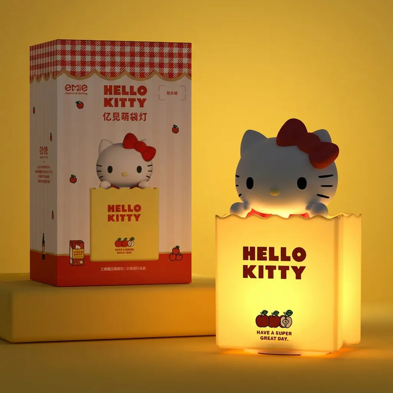 Veilleuse Hello Kitty sac silicone jaune allumee avec boite emballage officielle Hello Kitty Tendre Veilleuse