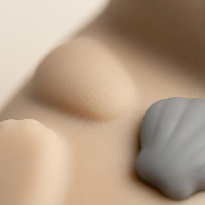 Detail macro texture silicone souple veilleuse loutre surface douce au toucher certifiee ROHS — Tendre Veilleuse
