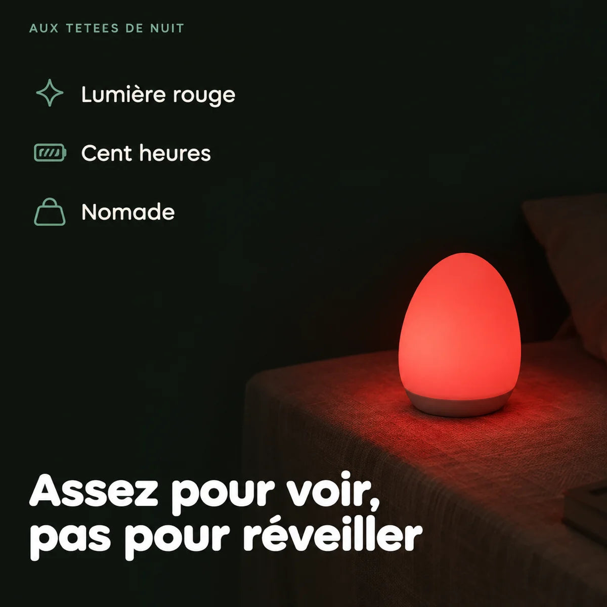 Veilleuse maternité à lumière rouge posée sur une table de chevet dans le noir, halo bas pour les tétées, Tendre Veilleuse